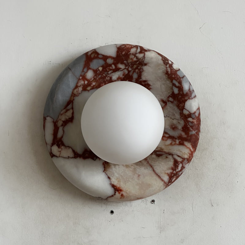 Elegant Red Marble Wall Sconce with Soft Ambient Lighting for Cozy Atmosphere