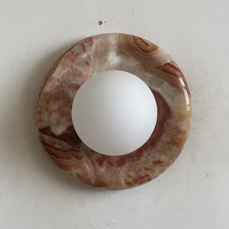 Elegant Red Marble Wall Sconce with Soft Ambient Lighting for Cozy Atmosphere