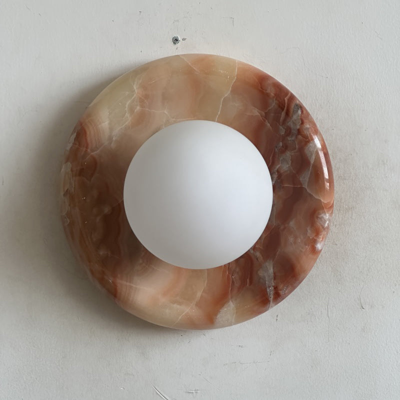 Elegant Red Marble Wall Sconce with Soft Ambient Lighting for Cozy Atmosphere