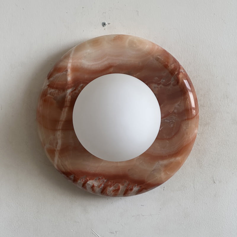 Elegant Red Marble Wall Sconce with Soft Ambient Lighting for Cozy Atmosphere