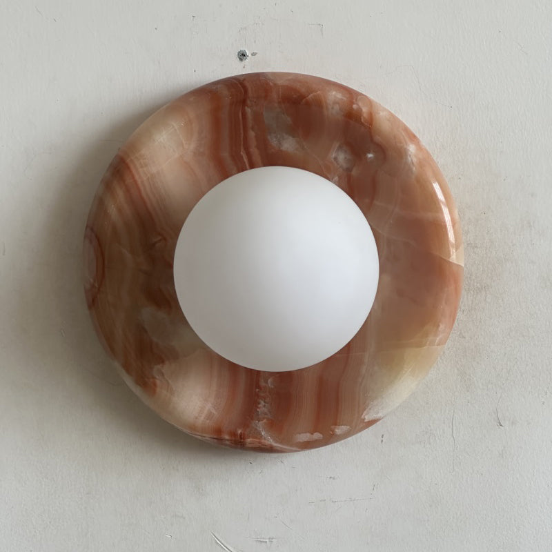 Elegant Red Marble Wall Sconce with Soft Ambient Lighting for Cozy Atmosphere