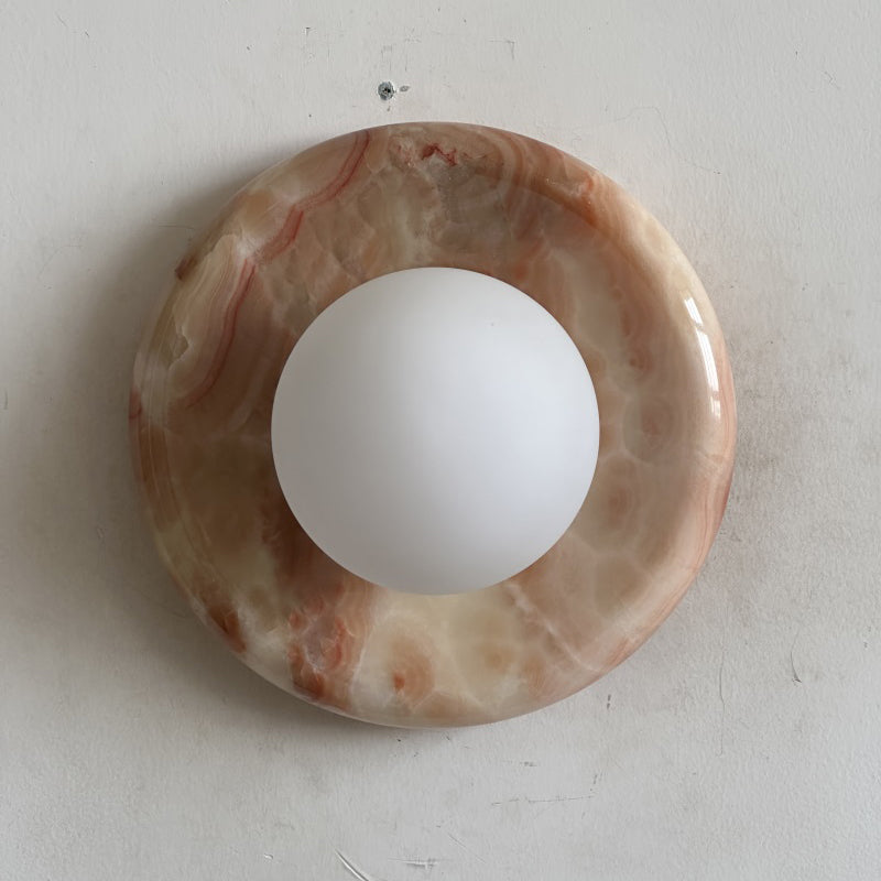 Elegant Red Marble Wall Sconce with Soft Ambient Lighting for Cozy Atmosphere