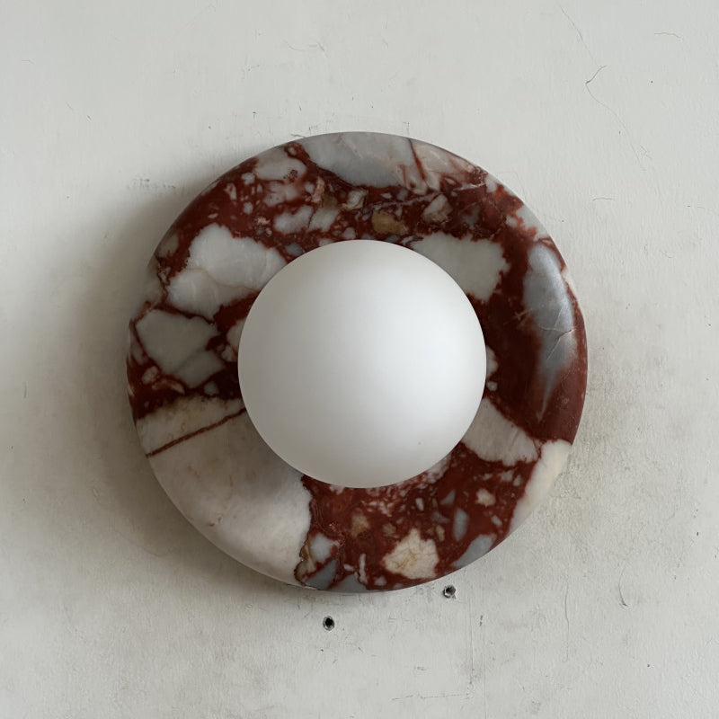 Elegant Red Marble Wall Sconce with Soft Ambient Lighting for Cozy Atmosphere