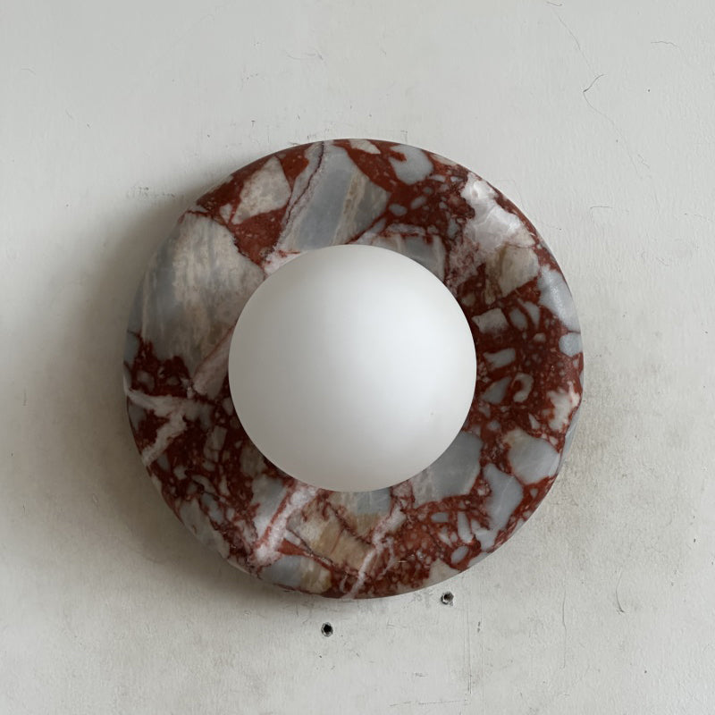 Elegant Red Marble Wall Sconce with Soft Ambient Lighting for Cozy Atmosphere