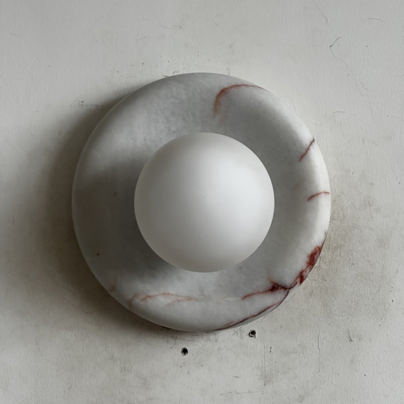 Elegant Red Marble Wall Sconce with Soft Ambient Lighting for Cozy Atmosphere