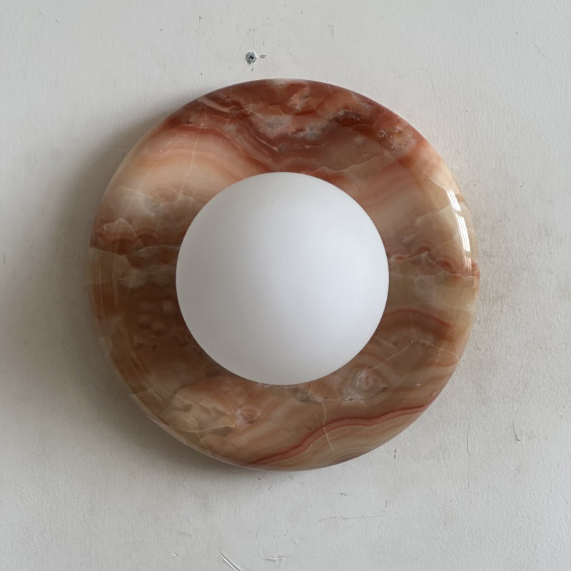 Elegant Red Marble Wall Sconce with Soft Ambient Lighting for Cozy Atmosphere