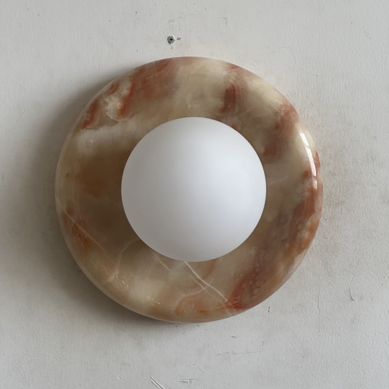 Elegant Red Marble Wall Sconce with Soft Ambient Lighting for Cozy Atmosphere
