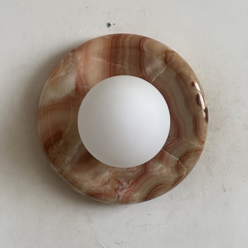 Elegant Red Marble Wall Sconce with Soft Ambient Lighting for Cozy Atmosphere