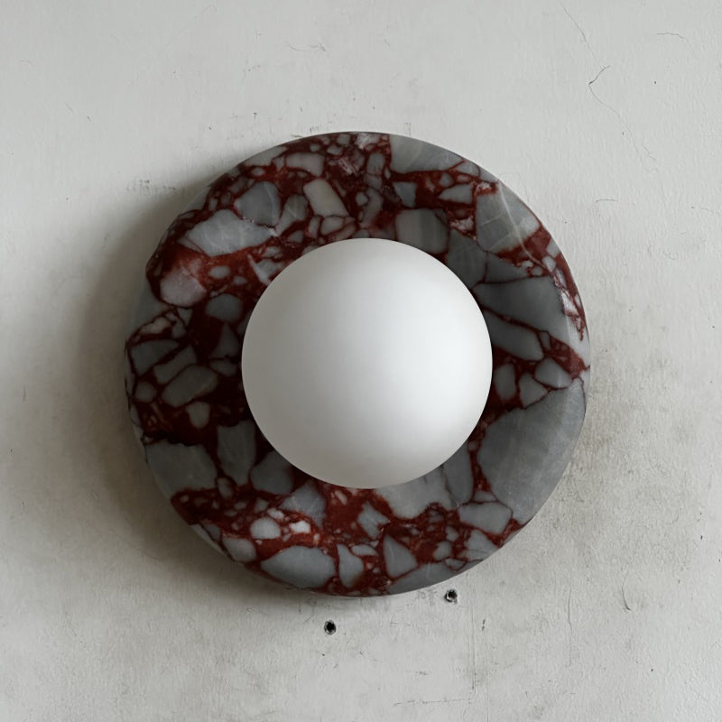 Elegant Red Marble Wall Sconce with Soft Ambient Lighting for Cozy Atmosphere