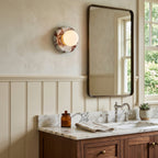 Elegant Red Marble Wall Sconce with Soft Ambient Lighting for Cozy Atmosphere
