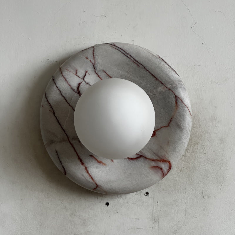Elegant Red Marble Wall Sconce with Soft Ambient Lighting for Cozy Atmosphere
